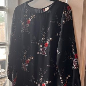 Size 12 long sleeve mid thigh dress with keyhole opening at the back.